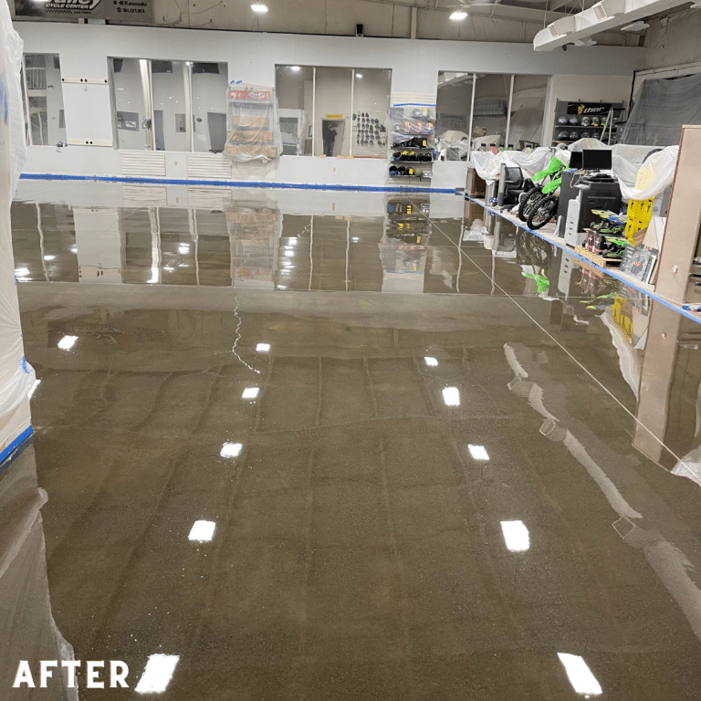 Image of a commercial concrete floor with a polished, shiny surface after being ground and sealed, with a speckled texture in shades of gray.